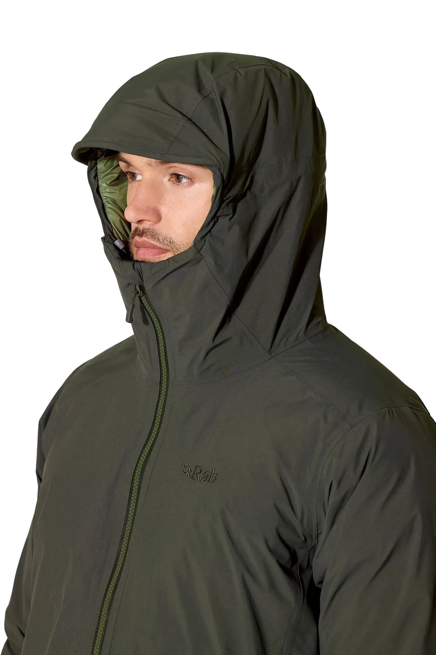 Rab Men's Valiance Waterproof Down Jacket in Dark Army (styling reference) - worn, hood up, front, face detail