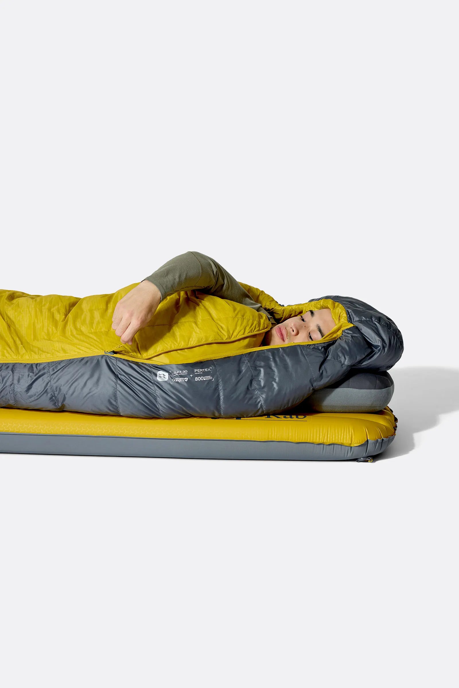 Rab Neutrino Down Sleeping Bag (-18°C/0F) in Graphene/Dark Pollen - Model Lying Side 2