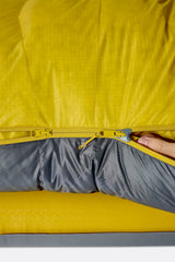Rab Neutrino Down Sleeping Bag (-6°C/20F) in Graphene/Dark Pollen - Model Sitting Up