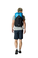 Rab Syclon XP 30L Waterproof Pack in Black/Maya Blue - Three Quarter View On Model 4