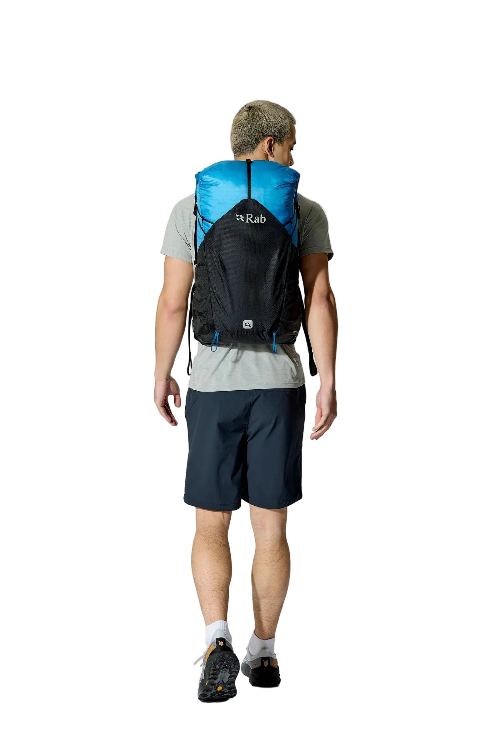 Rab Syclon XP 30L Waterproof Pack in Black/Maya Blue - Three Quarter View On Model 4