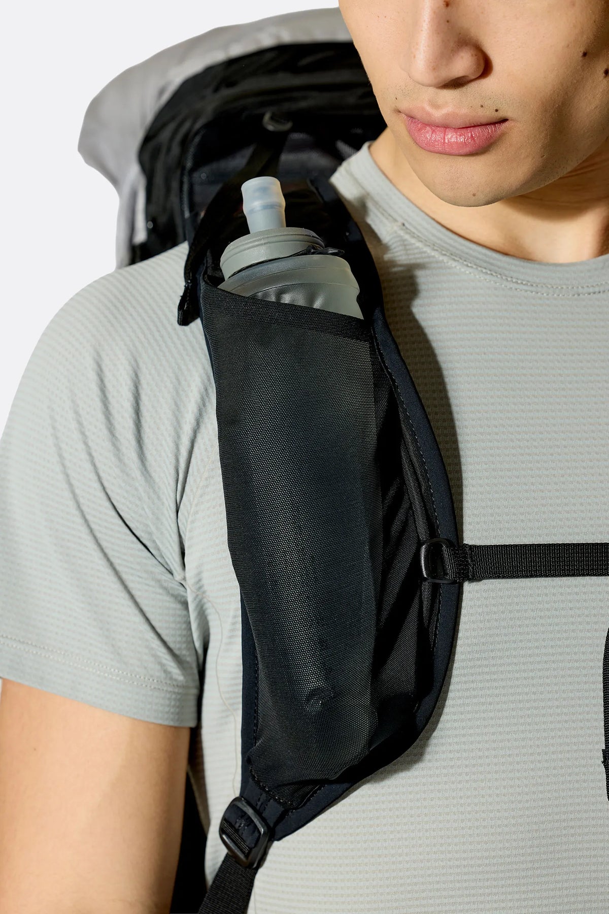 Rab Syclon XP 40L Waterproof Pack in Black/Dark Pewter - Three Quarter View On Model