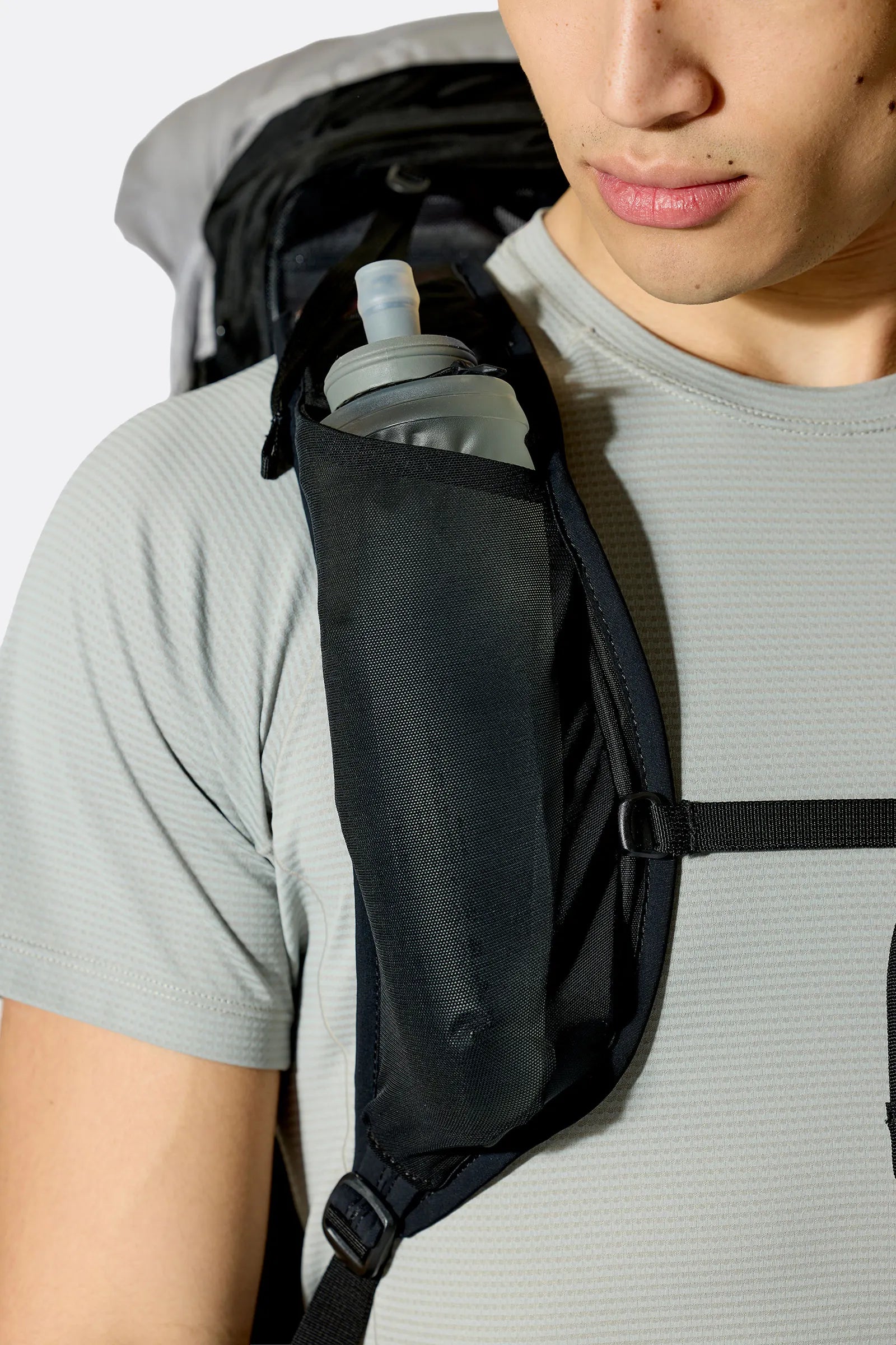 Rab Syclon XP 40L Waterproof Pack in Black/Dark Pewter - Three Quarter View On Model