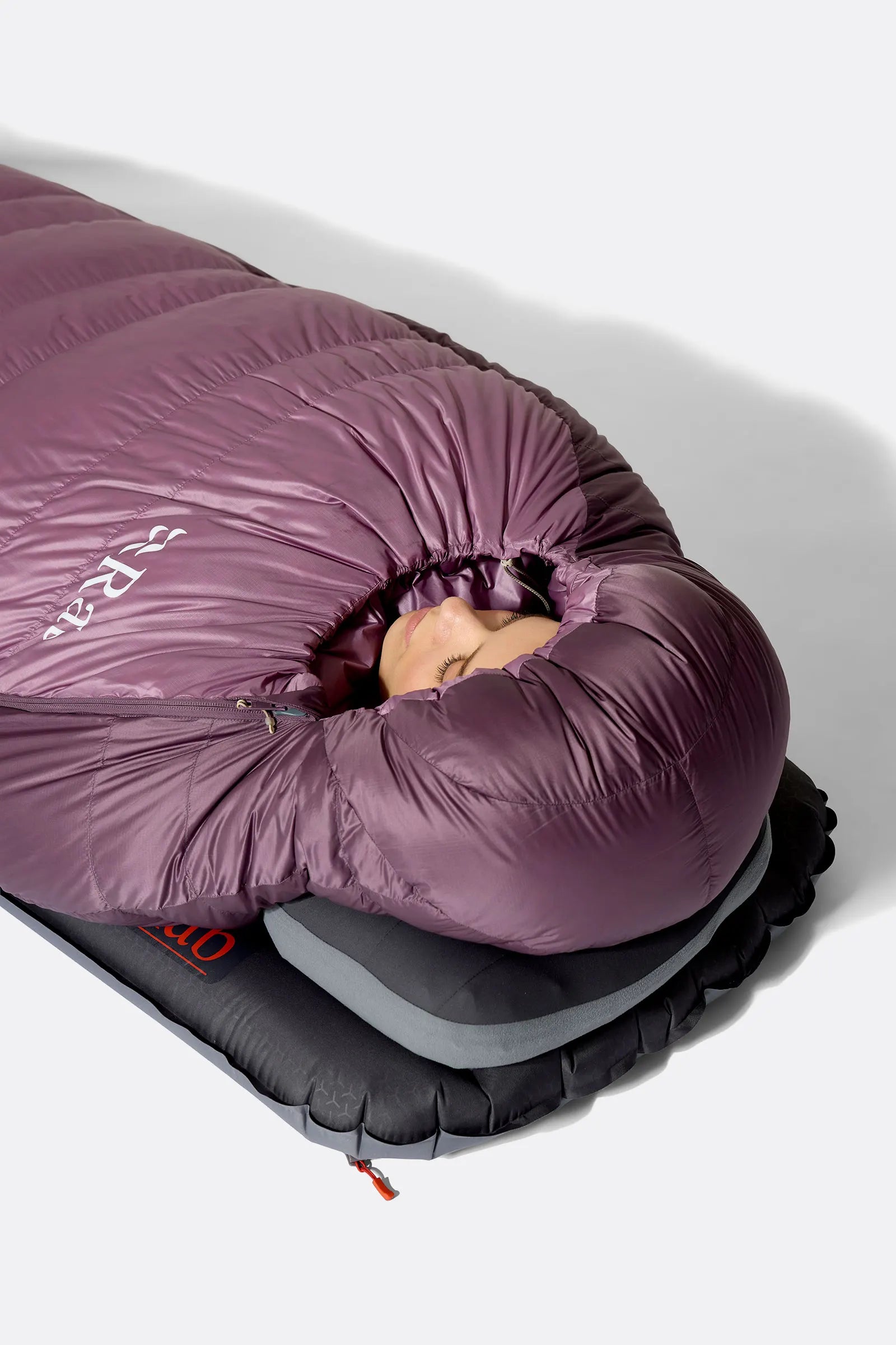 Rab Women's Alpine Down Sleeping Bag (-6°C/21F) in Iris/Dark Iris - Model Lying Overhead