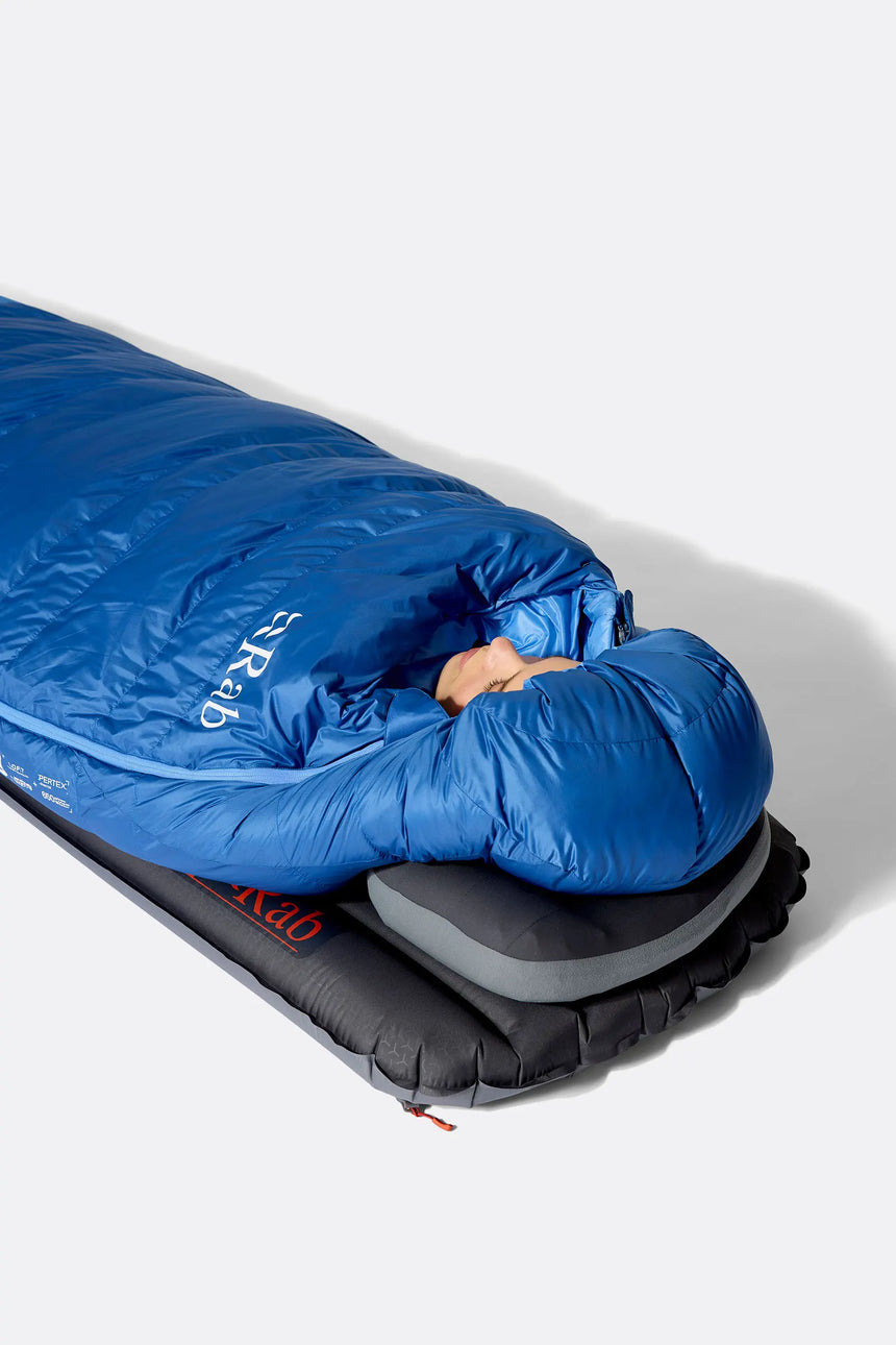 Rab Women's Ascent Down Sleeping Bag (-18°C/0F) in Dark BlueBird/BlueBird - Model Lying Side