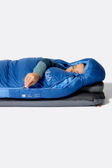 Rab Women's Ascent Down Sleeping Bag (-18°C/0F) in Dark BlueBird/BlueBird - Model Lying Top
