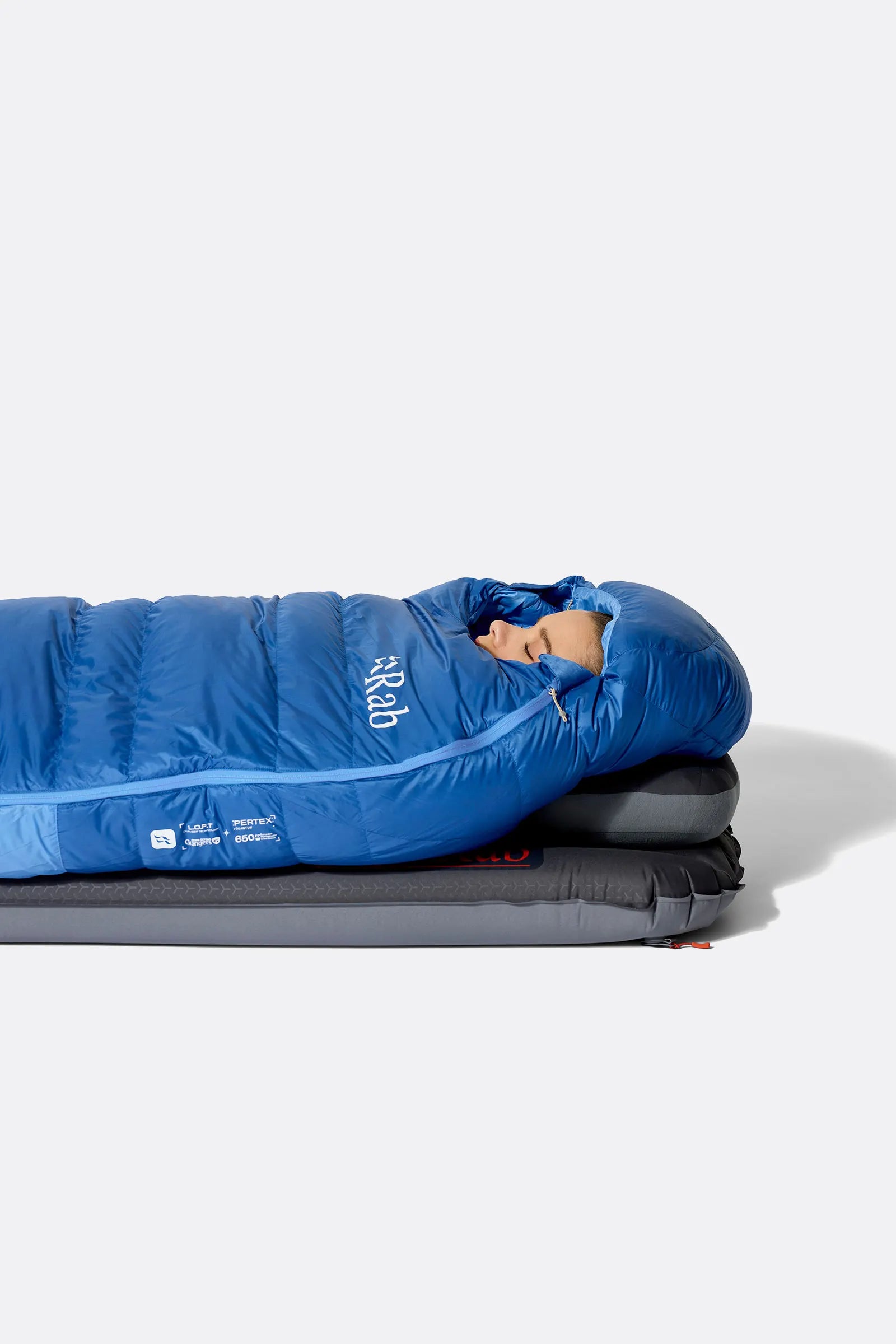 Rab Women's Ascent Down Sleeping Bag (-18°C/0F) in Dark BlueBird/BlueBird - Model Lying Wide
