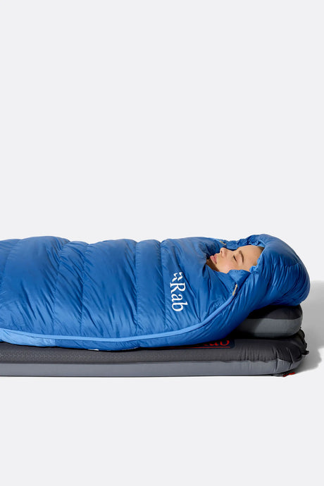 Rab Women's Ascent Down Sleeping Bag (-6°C/20F) in Dark Bluebird/Bluebird - Model Lying Top