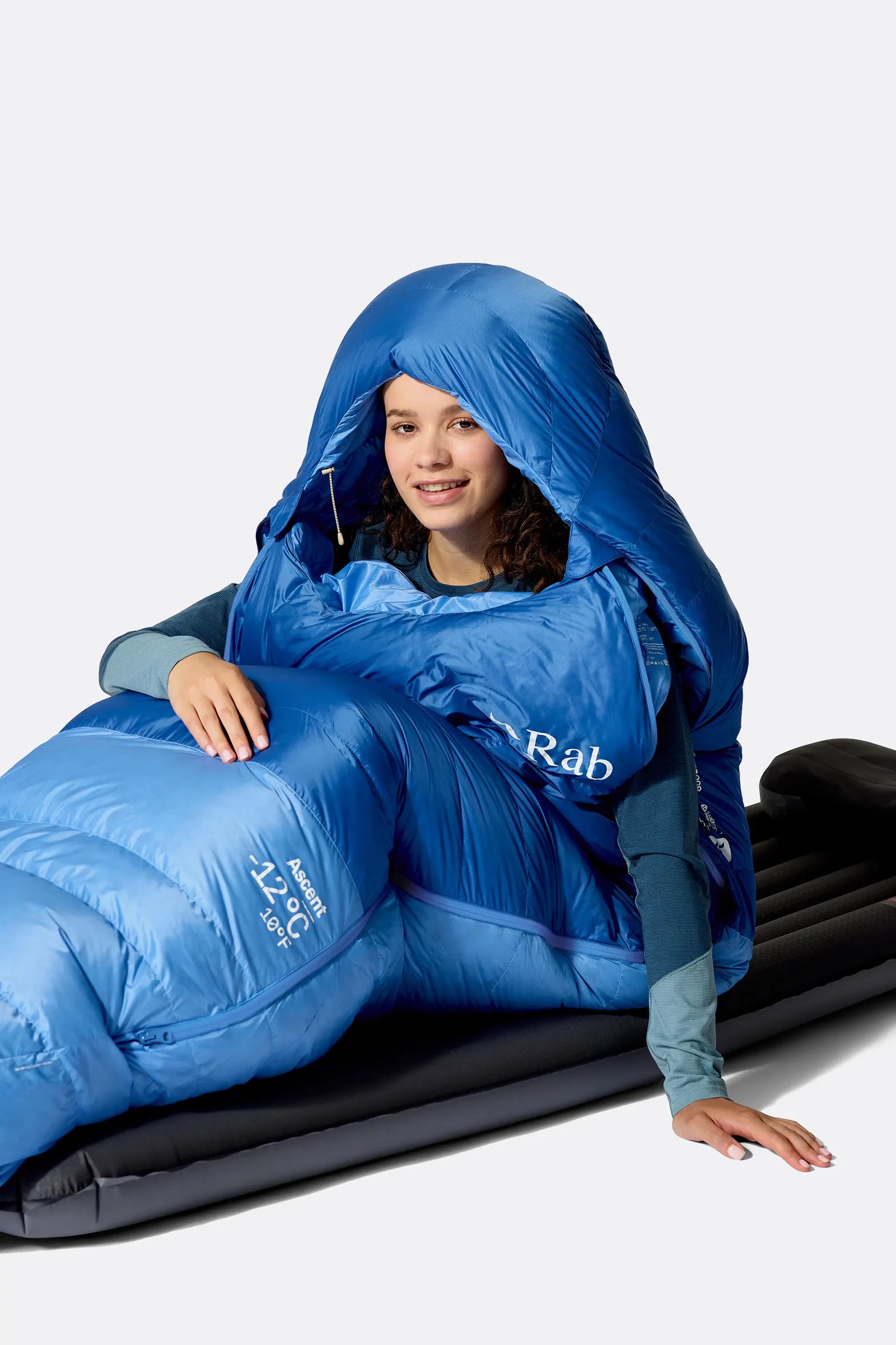 Rab Women's Ascent Down Sleeping Bag (-6°C/20F) in Dark Bluebird/Bluebird - Model Seated