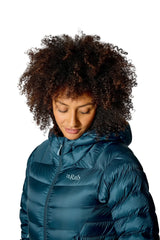 Rab Women's Electron Pro Down Jacket in Black - hood up, worn, looking down