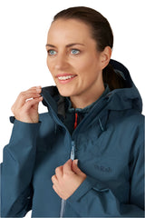 Rab Women's Namche GORE-TEX Jacket in Orion Blue - hood adjustment detail, worn