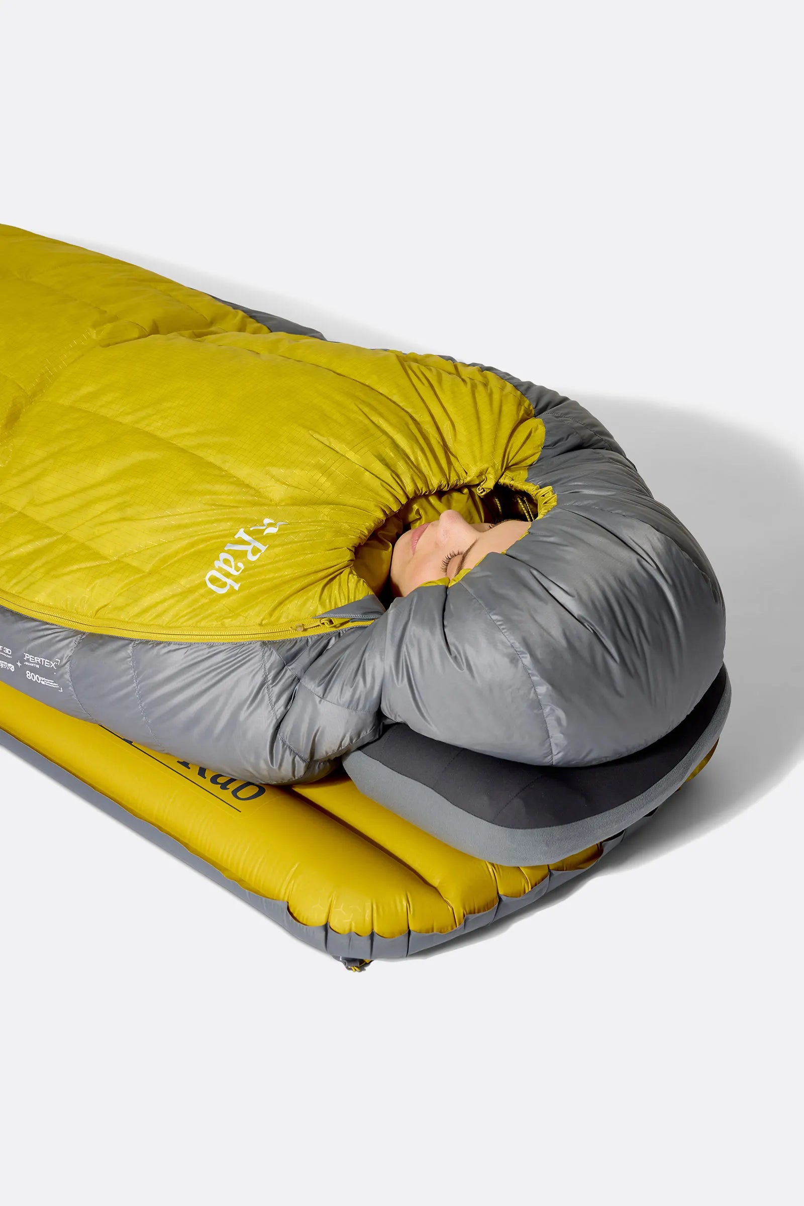 Rab Women's Neutrino Down Sleeping Bag (-6°C/20F) in Zinc/Dark Pollen - Model Reclined