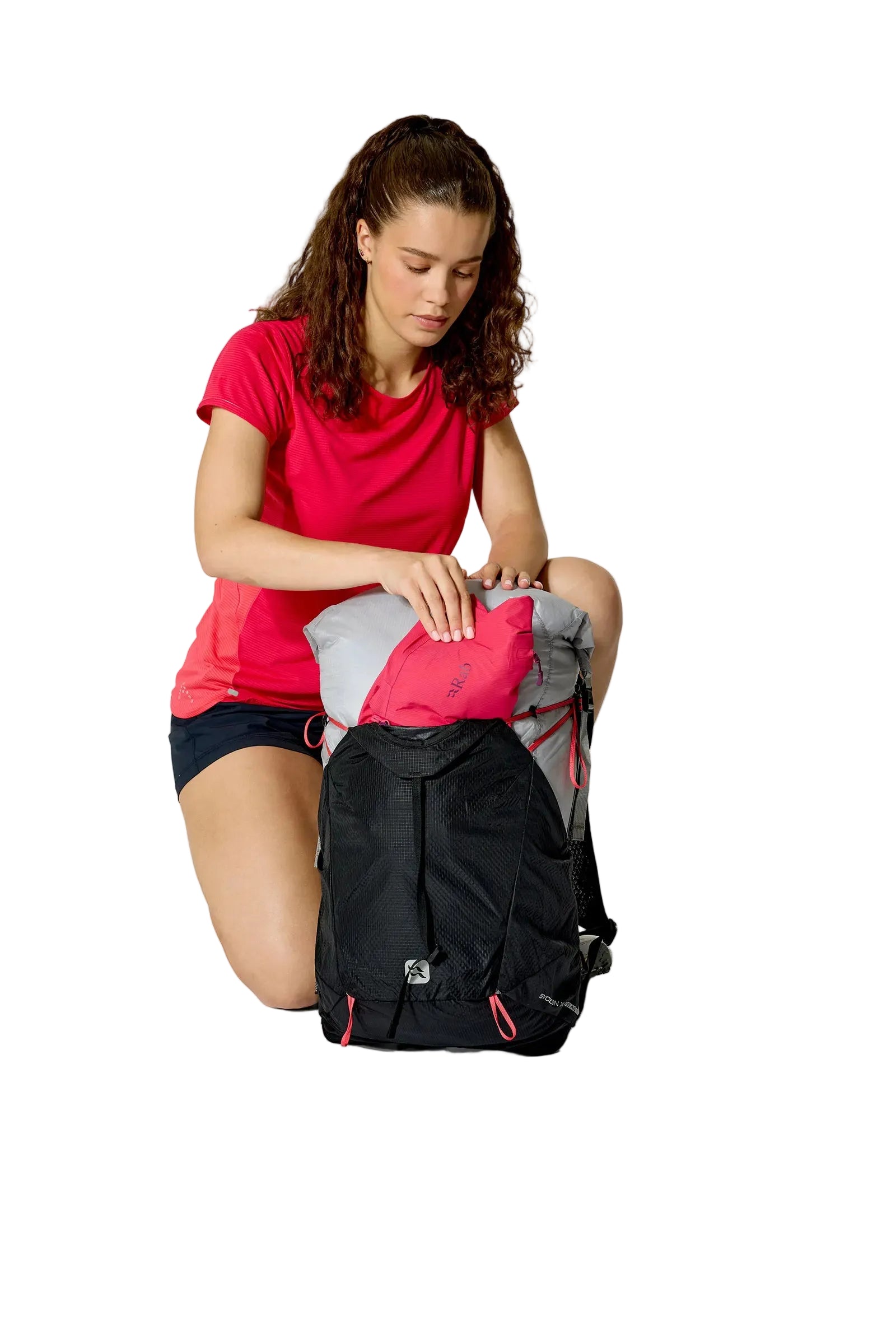 Rab Women's Syclon XP ND 28L Waterproof Pack in Black/Dark Pewter - Seated View On Model 2