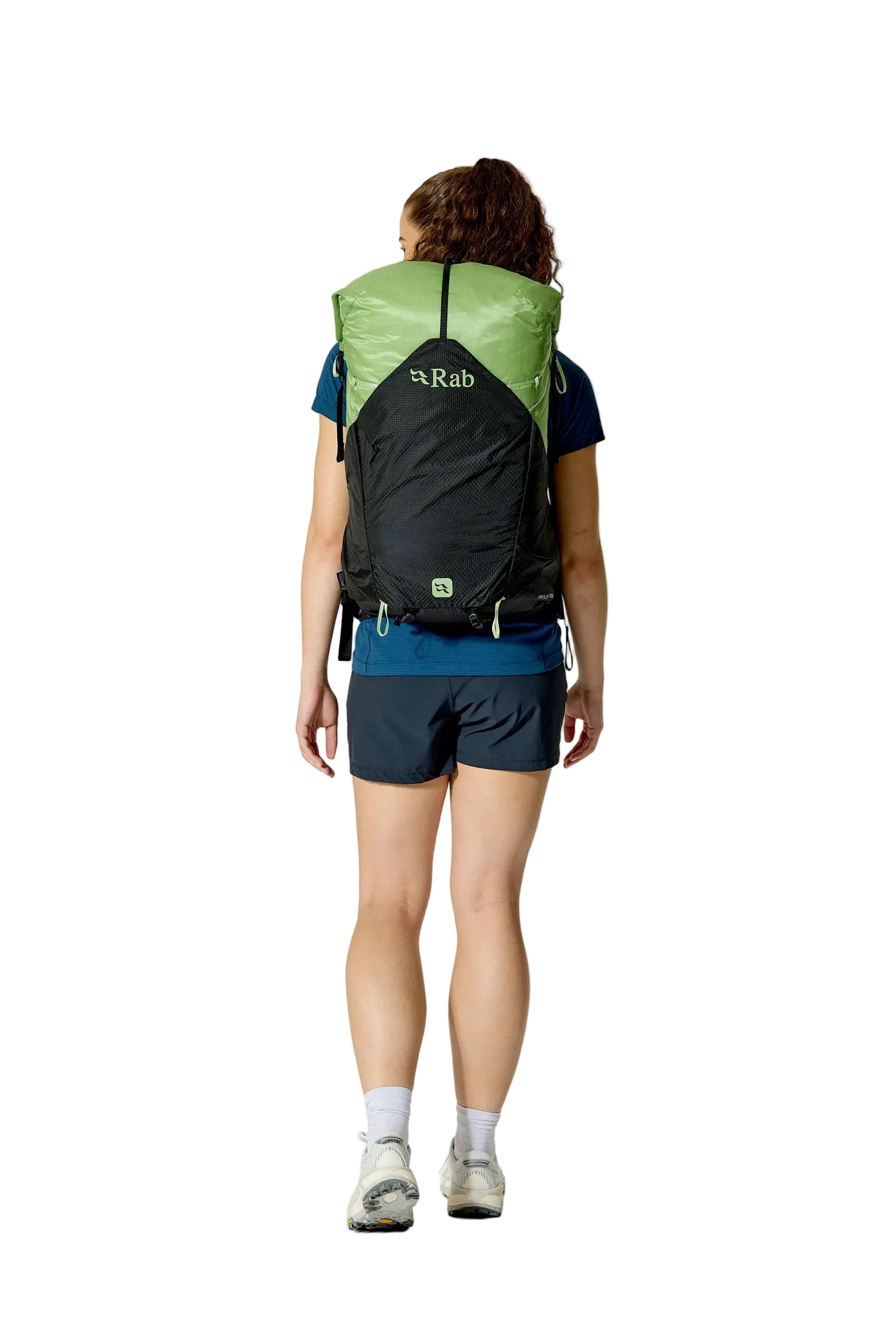 Rab Women's Syclon XP ND 38L Waterproof Pack in Black/Dark Fig Green - Side View On Model 2