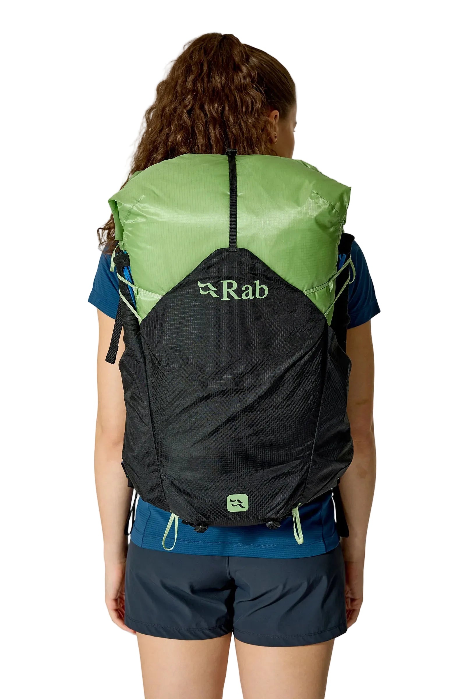 Rab Women's Syclon XP ND 38L Waterproof Pack in Black/Dark Fig Green - Three Quarter View On Model 4