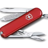 Red Swiss Army knife with open tools on a white background