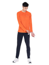 Ronhill Men's Core L/S Tee in Ronhill Red - worn, three-quarter