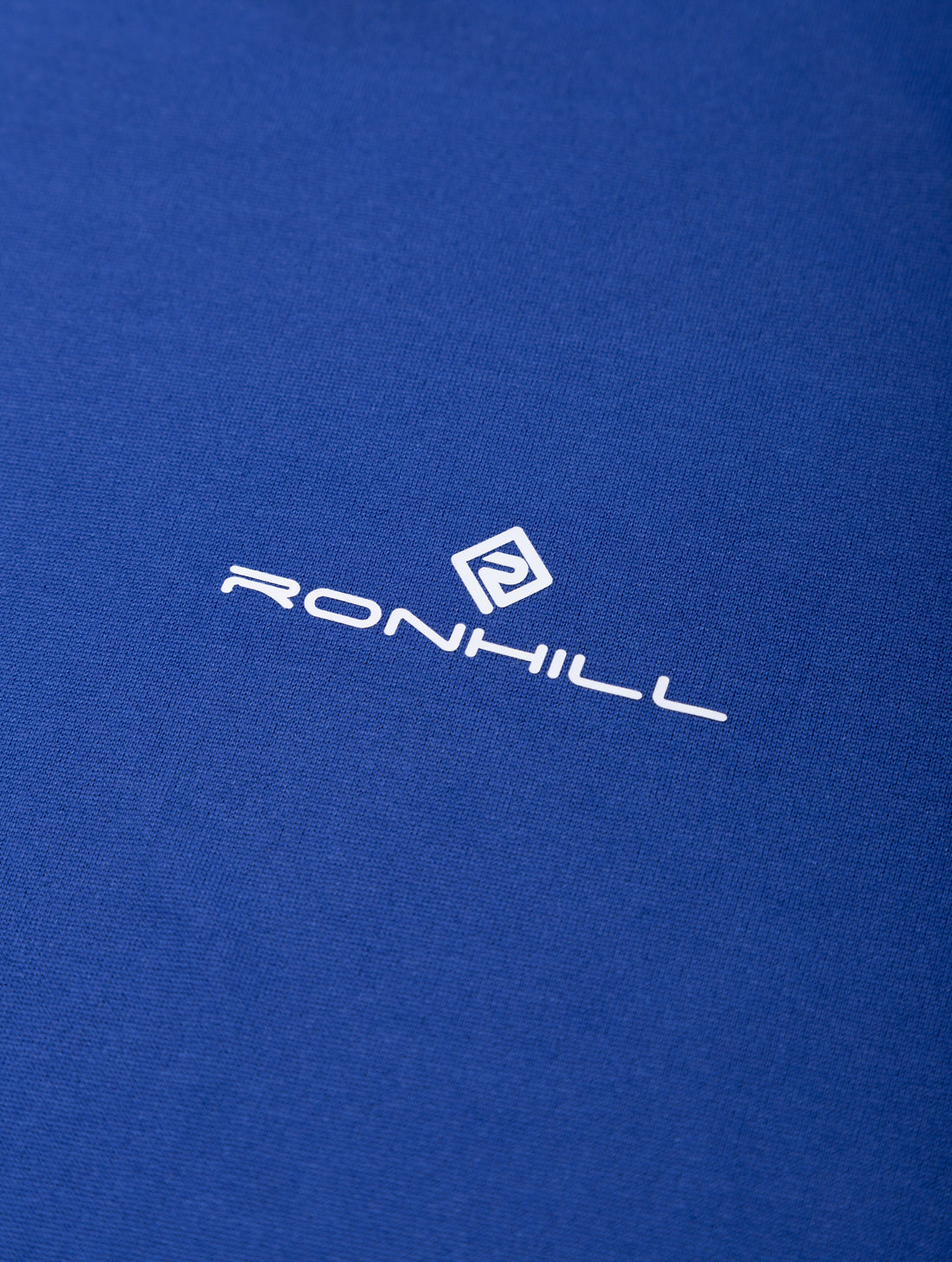 Ronhill Men's Core S/S Tee in Dark Cobalt/Bright White - logo detail