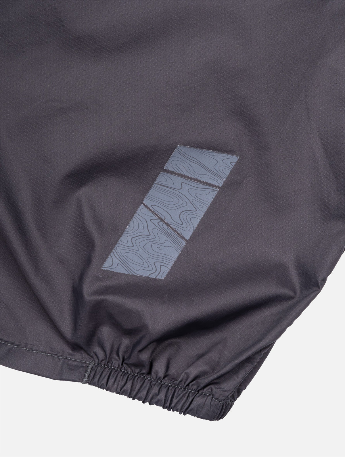 Ronhill Men's Tech All-Terrain Jacket in Oxide/Ronhill Red - reflective detail