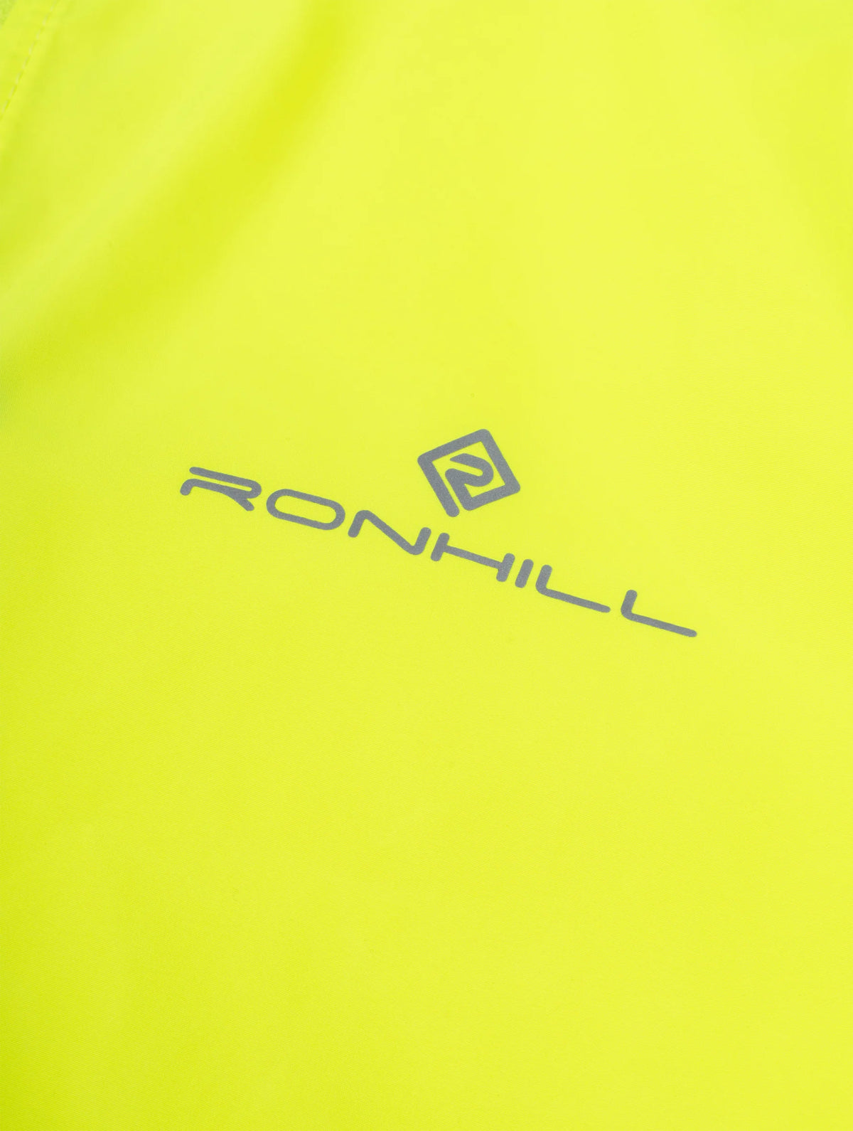 Ronhill Women's Core Jacket in Fluo Zest - logo detail