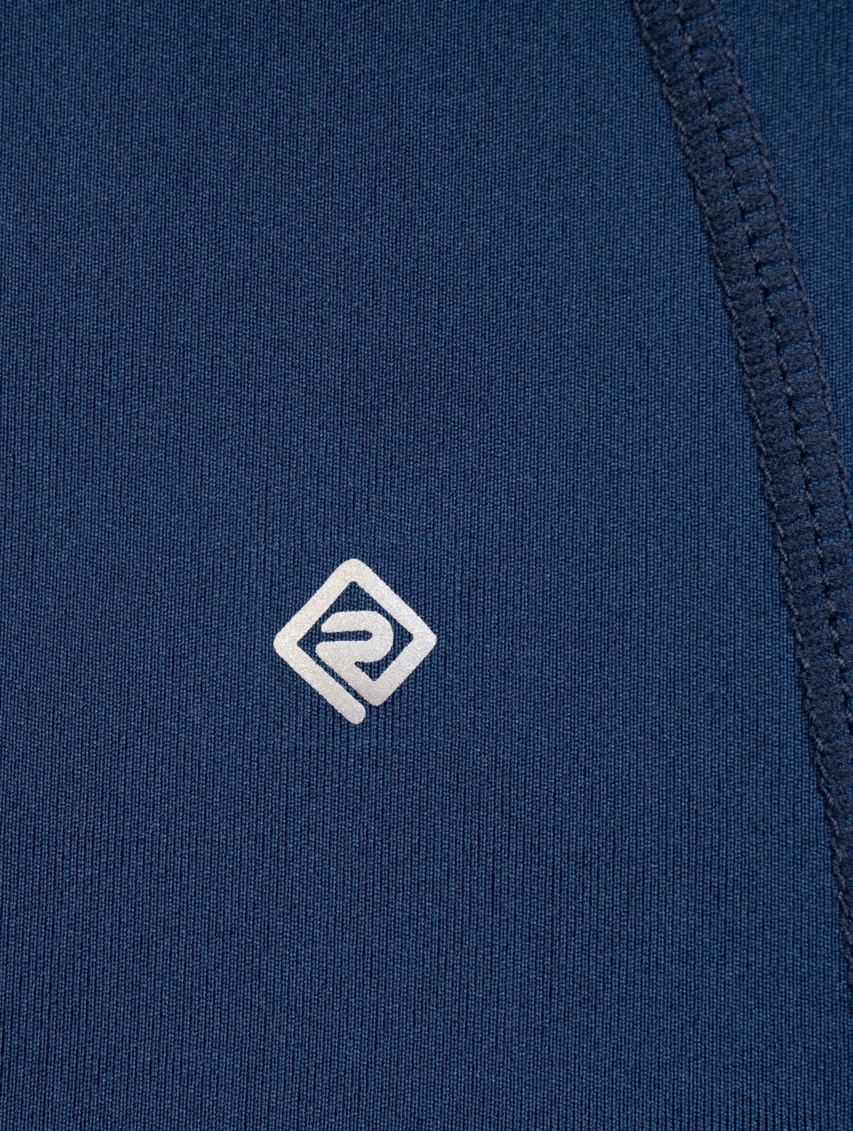 Ronhill Women's Tech Contour Jacket in Dark Navy - reflective logo tab detail
