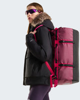 The North Face Base Camp Duffel - Small in Burgundy Crush/TNF Black - worn, back view
