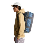 The North Face Base Camp Voyager Duffel 42L in Anthracite Grey/Pigment Yellow - worn, side profile