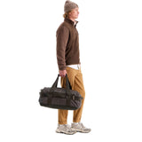 The North Face Base Camp Voyager Duffel 42L in Dark Chestnut/Garnet - worn