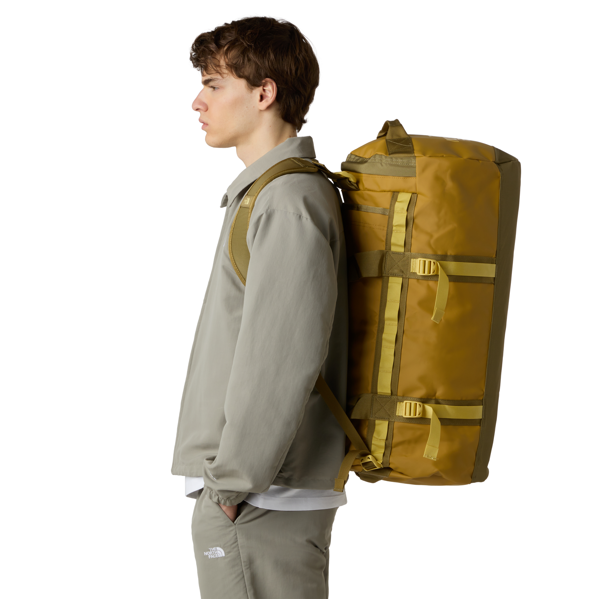 The North Face Base Camp Duffel Medium Golden Tan/Cedar - side view with detachable ergonomic shoulder straps and padded handles