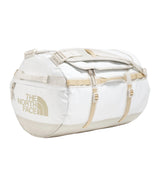 The North Face Base Camp Duffel Small 50L White Ash/Calac - lifestyle shot showing versatile backpack and duffel carry options