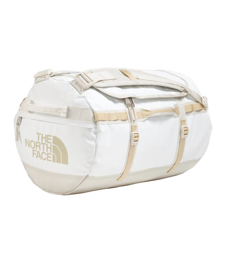 The North Face Base Camp Duffel Small 50L White Ash/Calac - lifestyle shot showing versatile backpack and duffel carry options