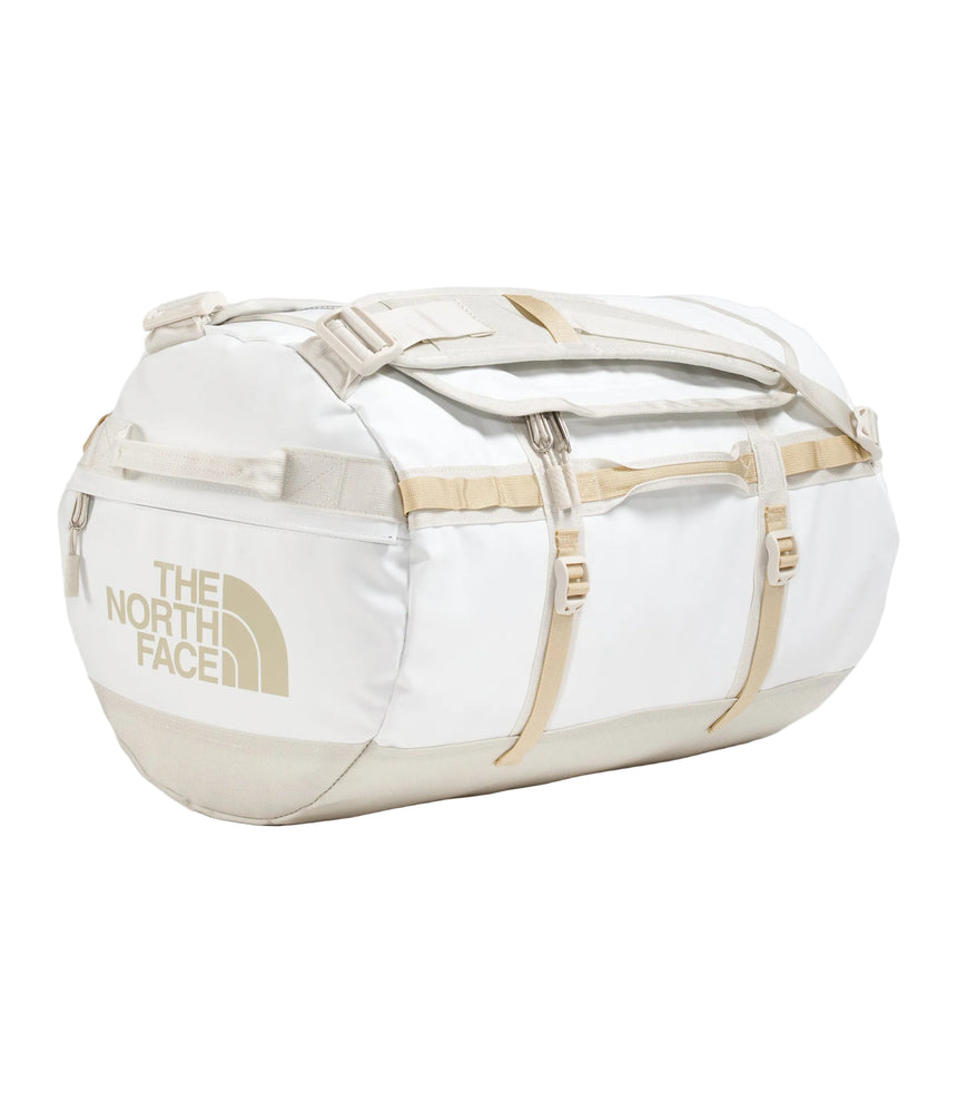 The North Face Base Camp Duffel Small 50L White Ash/Calac - lifestyle shot showing versatile backpack and duffel carry options