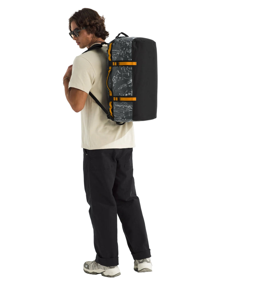 The North Face Base Camp Duffel Small Anthracite Grey - side view with detachable ergonomic shoulder straps and padded handles