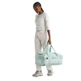 The North Face Base Camp Voyager Duffel 42L Opal Frost-Pearl/Stone White Model Holding Duffel