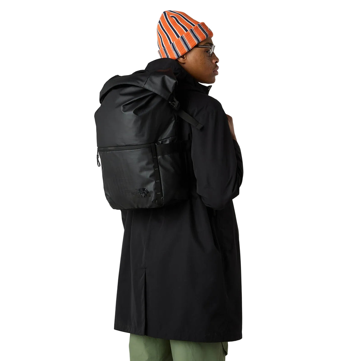 Side view of The North Face Base Camp Voyager Roll Top Backpack displaying water bottle pockets and daisy-chain webbing