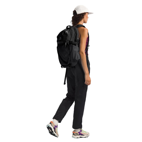 Side view of The North Face Router Backpack displaying water bottle pockets and compression straps
