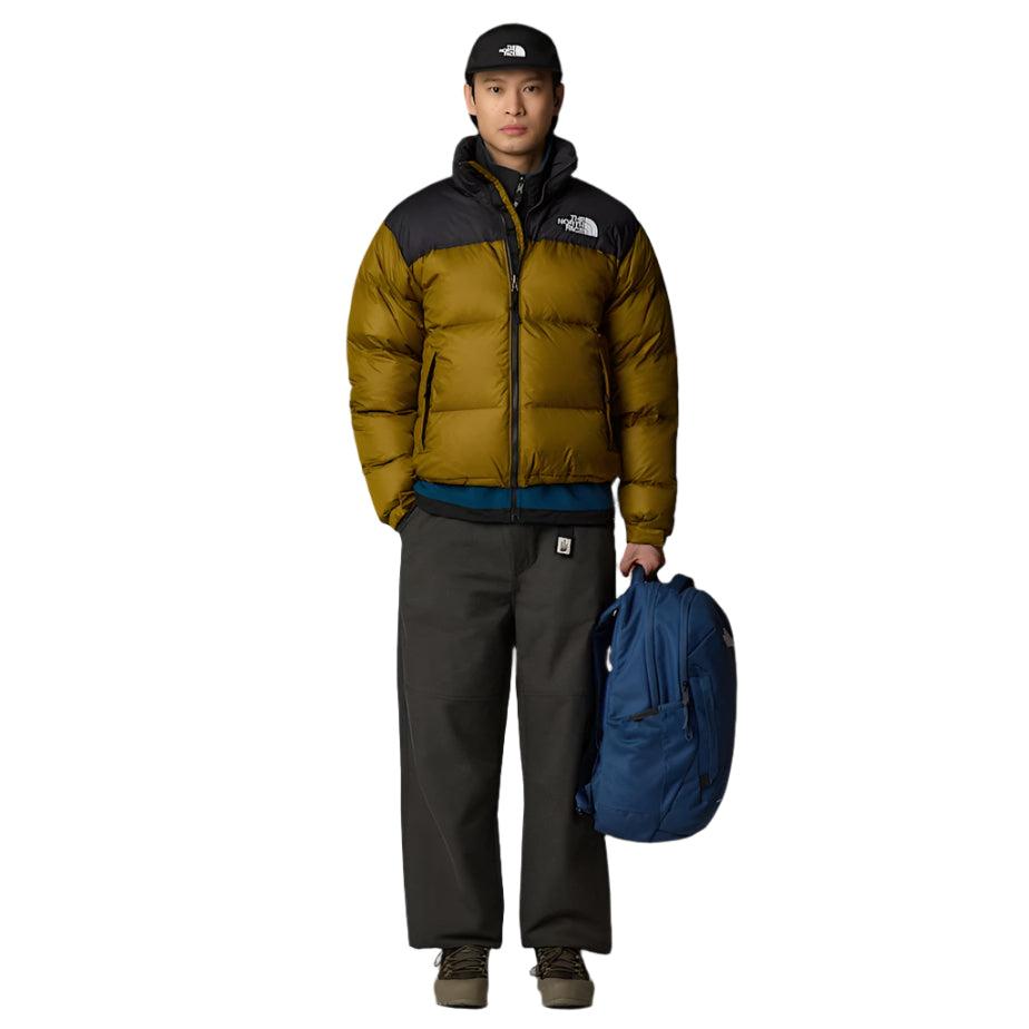 The North Face Vault Backpack Shady Blue/White - lifestyle shot showing sleek profile and 360-degree reflective visibility