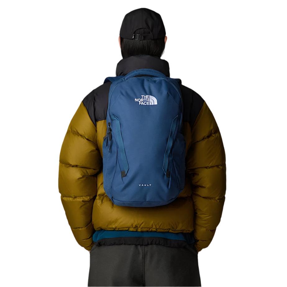 The North Face Vault Backpack Shady Blue/White - side view with external mesh water bottle pockets and reflective detailing