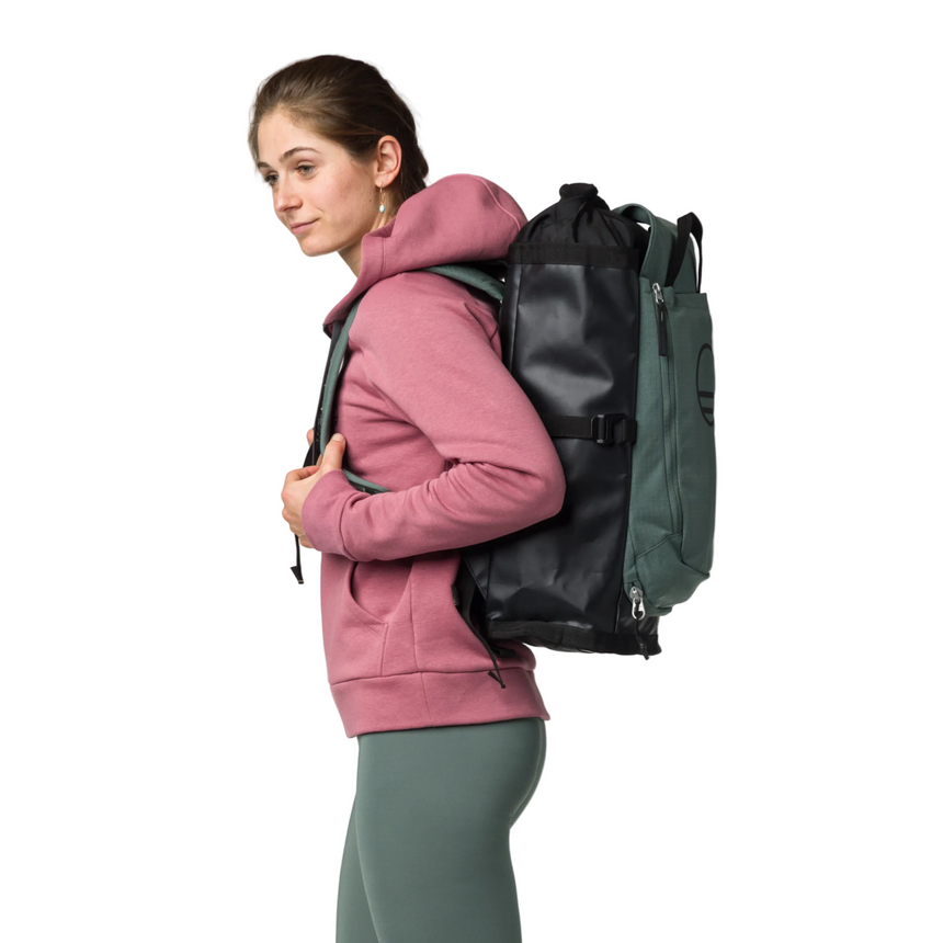 Wild Country Climbing Crag Hauler 25 Backpack Outdoor Action Black/Marsh - side view of model wearing pack 
