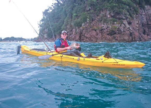 Mission CATCH 420 EXP kayak, kayak in use on calm water