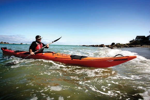 Mission ECO BEZHIG 540 kayak, Red Fade kayak paddling near shore