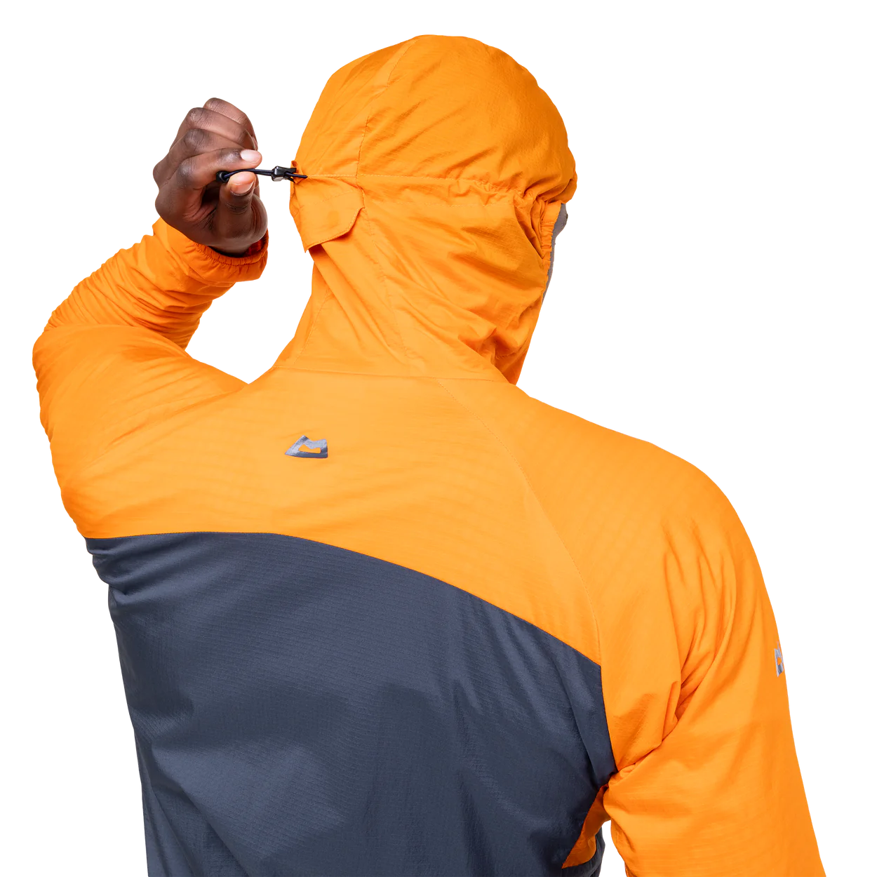 Zipped chest pocket detail on Mountain Equipment Aerotherm Men's Jacket in Blue Nights/Ember doubling as stuff sack with twin karabiner carry loops