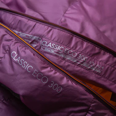 Mountain Equipment Classic Eco 300 Women's Sleeping Bag in Raisin packed into waterproof roll-top stuff sack