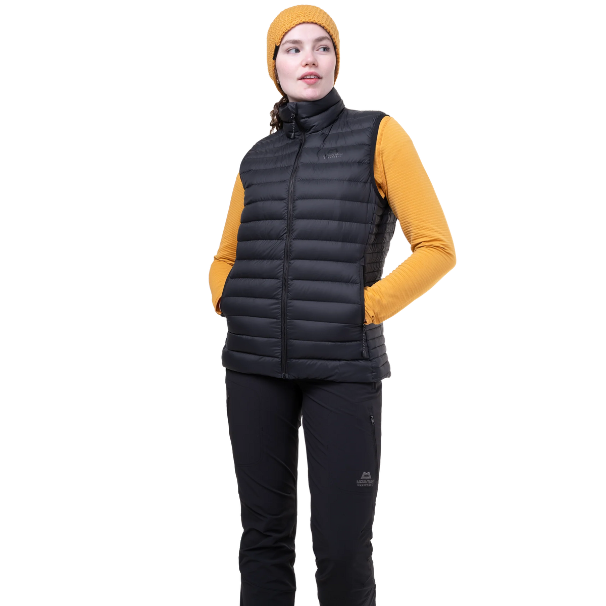 Mountain Equipment Earthrise Women's Vest in Black - side view showing fit and dual tether hem drawcords