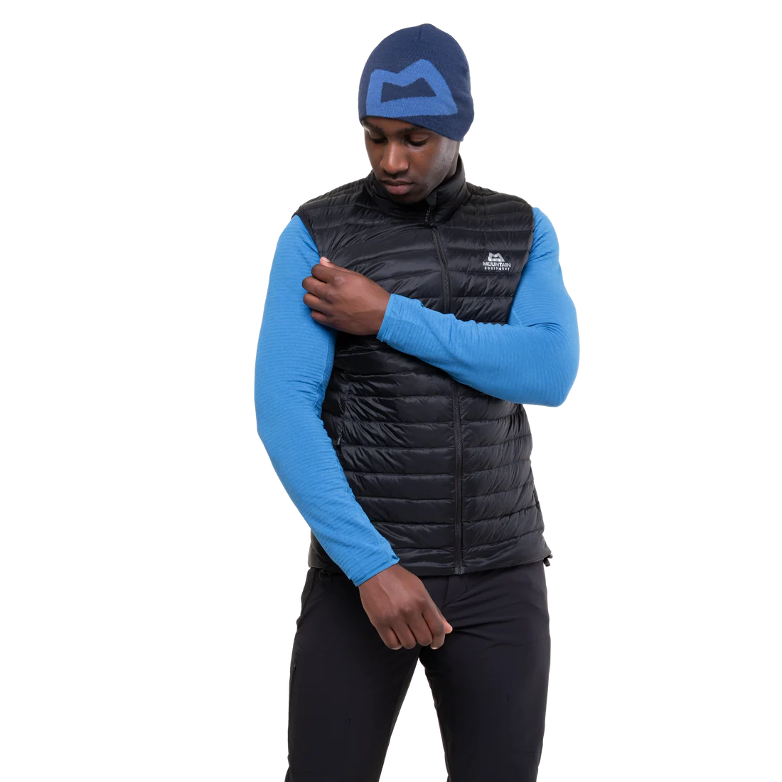 Mountain Equipment Frostline Men's Vest in Black worn on model showing elastane-bound armhole detail