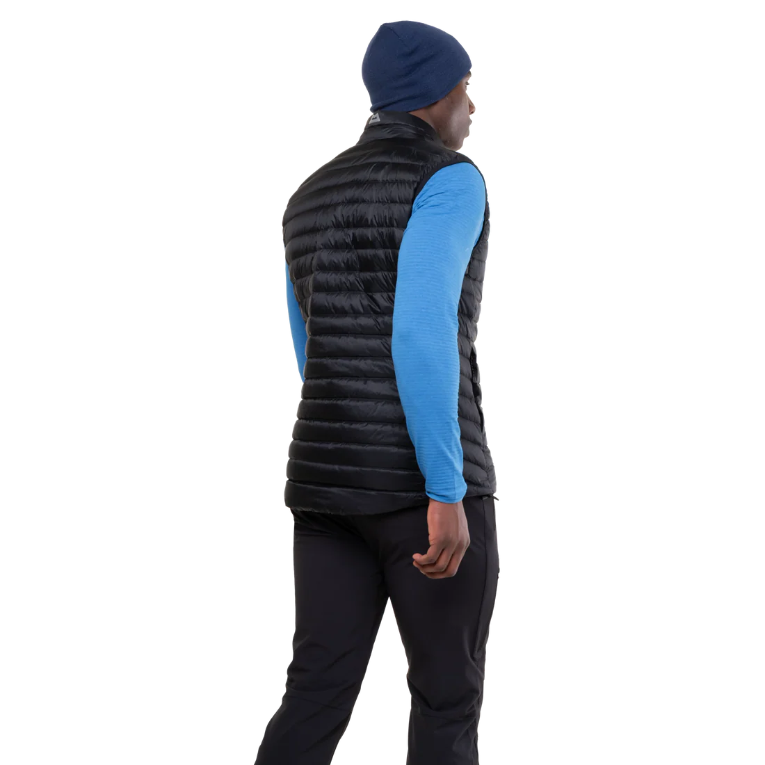 Mountain Equipment Frostline Men's Vest in Black worn on model - angled back view showing DRILITE Loft 20D shell and elastane-bound armholes