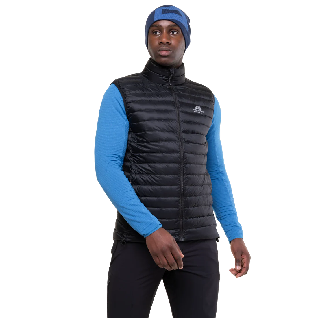 Mountain Equipment Frostline Men's Vest in Black worn on model - front view showing YKK front zip with insulated baffle and zipped hand warmer pockets