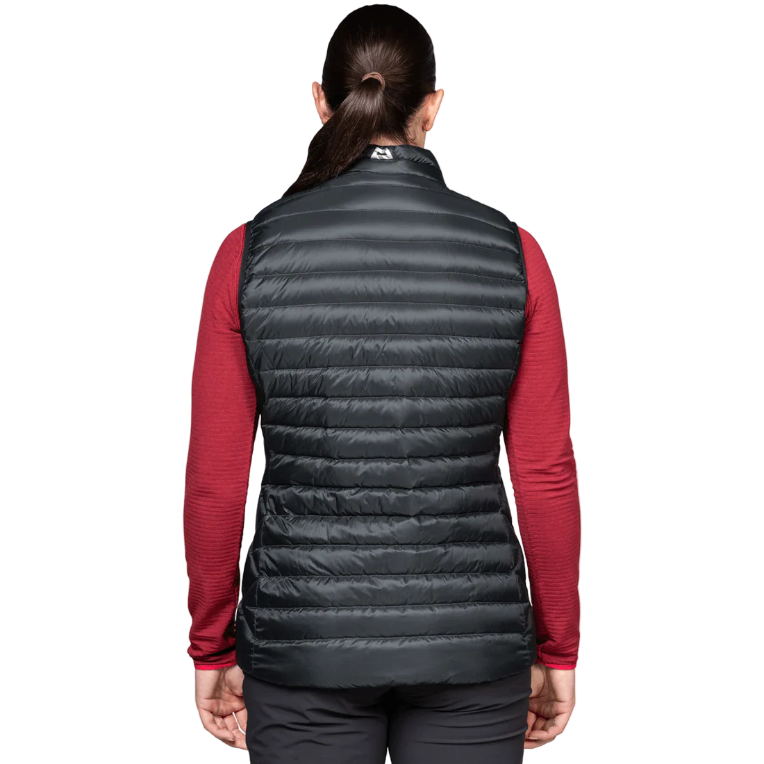 Mountain Equipment Frostline Women's Vest in Black worn on model - back view showing DRILITE Loft 20D shell and elastane-bound armholes