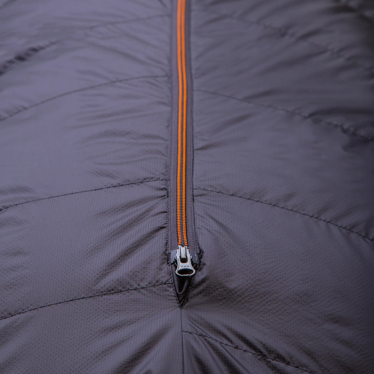 Mountain Equipment Glacier 1000 Sleeping Bag in Obsidian - lifestyle view showing cold weather sleeping bag for winter mountaineering and high-altitude trekking