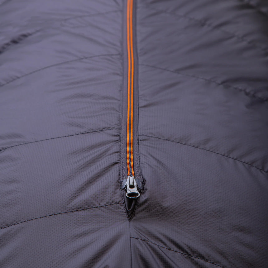 Mountain Equipment Glacier 1000 Sleeping Bag in Obsidian - lifestyle view showing cold weather sleeping bag for winter mountaineering and high-altitude trekking